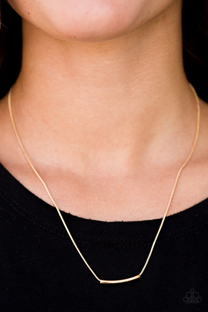 A bowing gold rod slides along a rounded gold snake-chain, creating a bold minimalistic look below the collar. Features an adjustable clasp closure.  Sold as one individual necklace. Includes one pair of matching earrings.   Always nickel and lead free.