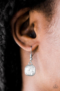 Featuring sparkling faceted surfaces, a glittery square gem is pressed into the center of a sleek silver frame, creating a glamorous lure. Earring attaches to a standard fishhook fitting.  Sold as one pair of earrings.  Always nickel and lead free.