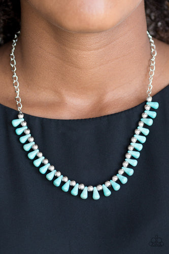 Turquoise teardrop stones and classic silver beads are threaded along an invisible wire. The earthy beads alternate below the collar, creating a wild fringe. Features an adjustable clasp closure.  Sold as one individual necklace. Includes one pair of matching earrings.  Always nickel and lead free.  Item #P2SE-BLXX-310XX
