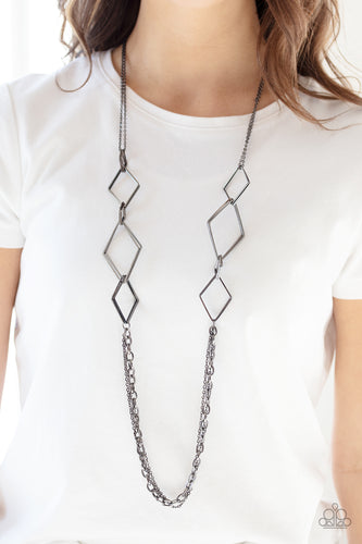 A collection of interlocking diamond-shaped frames give way to rows of mismatched gunmetal chains, creating edgy layers across the chest. Features an adjustable clasp closure.  Sold as one individual necklace. Includes one pair of matching earrings.   Always nickel and lead free.