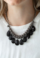 Load image into Gallery viewer, A row of glistening gunmetal beads gives way to glassy black teardrops, creating a bold tone on tone fringe below the collar. Features an adjustable clasp closure.  Sold as one individual necklace. Includes one pair of matching earrings.   