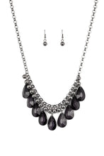 Load image into Gallery viewer, A row of glistening gunmetal beads gives way to glassy black teardrops, creating a bold tone on tone fringe below the collar. Features an adjustable clasp closure.  Sold as one individual necklace. Includes one pair of matching earrings.   