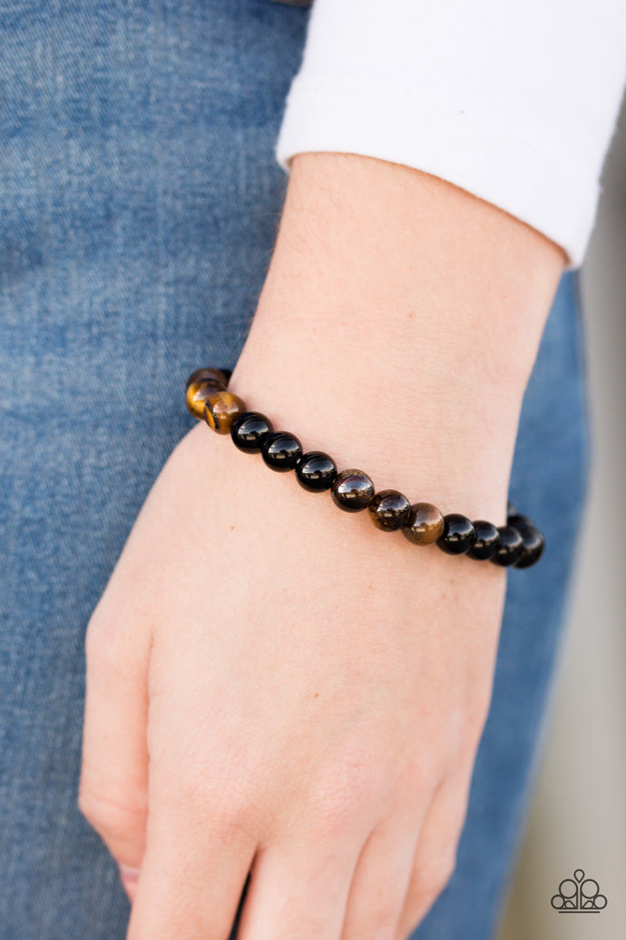 Smooth black and tiger’s eye stone accents are threaded along an elastic stretchy band for an earthy look.  Sold as one individual bracelet.  Always nickel and lead free.
