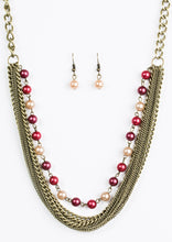 Load image into Gallery viewer, A strand of classic colorful pearls gives way to layers of mismatched brass chain, creating a fierce look below the collar. Features an adjustable clasp closure.  Sold as one individual necklace. Includes one pair of matching earrings.