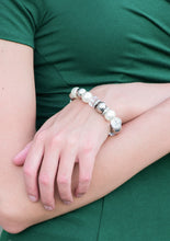 Load image into Gallery viewer, Over-sized silver, crystal-like, and pearly white beads are threaded along a stretchy elastic band and wrapped around the wrist for a glamorous look. White rhinestone encrusted rings are sprinkled between the dramatic beads for a sparkling finish.  Sold as one individual bracelet.