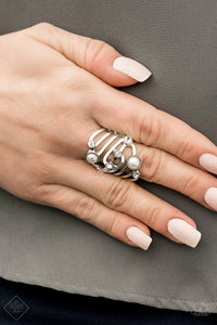 Dotted in glassy white rhinestones and dainty white pearls, whirling silver bands sweep across the finger in a refined finish. Features a stretchy band for a flexible fit. 