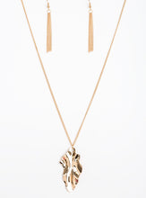 Load image into Gallery viewer, ﻿An elongated gold chain gives way to a rippling gold leaf-like pendant for a seasonal look. Features an adjustable clasp closure.  Sold as one individual necklace. Includes one pair of matching earrings.