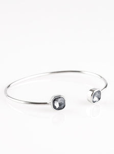 Attached to a curling silver bar, square smoky rhinestones are pressed into silver fittings, creating a dainty cuff.  Sold as one individual bracelet.
