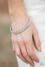 Load image into Gallery viewer, A silver bangle adorned in shimmery white pearls and glistening white rhinestones is paired with two classic silver bangles for a layered look.
