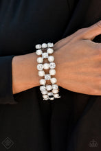 Load image into Gallery viewer, Classic white pearls and brilliant white rhinestones are nestled into sleek silver frames and threaded along a stretchy band that wraps glamorously around the wrist.