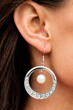 Load image into Gallery viewer, A single white pearl is suspended gracefully from the top of a shimmery silver hoop. Glittery white rhinestones sparkle along the bottom of the frame, gradually increasing in size as they reach the center for a glamorous finish. Earring attaches to a standard fishhook fitting.  Sold as one pair of earrings.