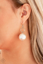 Load image into Gallery viewer, A dramatically over sized white pearl dangles from a dainty silver ring, coalescing into a refined statement piece. Earring attaches to a standard fishhook fitting.