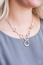Load image into Gallery viewer, Asymmetrical silver hoops connect with pearly white beads below the collar for a refined look. Features an adjustable clasp closure.