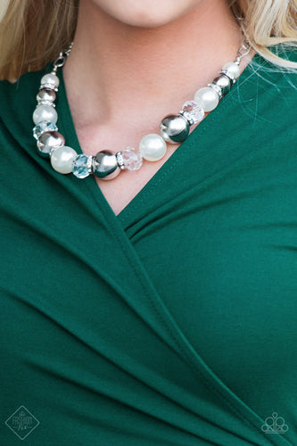 Oversized silver, crystal-like, and pearly white beads are threaded along an invisible wire below the collar for a glamorous look. White rhinestone encrusted rings are sprinkled between the dramatic beads for a sparkling finish. Features an adjustable clasp closure.  Sold as one individual necklace. Includes one pair of matching earrings   Fiercely 5th Avenue Fashion Fix October 2018  Always nickel and lead free.