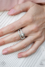 Load image into Gallery viewer, Two skinny silver bars decorated in tiny white rhinestones run parallel to each other, creating a layered band. A tiny white pearl encircled by a classic silver frame sits atop one of the silver bars, creating a refined centerpiece. Features a dainty stretchy band for a flexible fit.