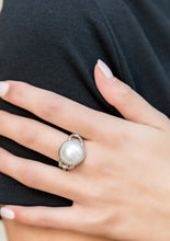 Load image into Gallery viewer, A pearly white bead is pressed into the center of a classic silver frame, creating a classic statement piece that sits atop the finger. Features a dainty stretchy band for a flexible fit.
