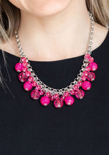 Load image into Gallery viewer, A collection of glassy and opaque pink crystal-like beads swing from the bottom of interlocking silver chains, creating a fabulous fringe below the collar. Features an adjustable clasp closure.  Sold as one individual necklace. Includes one pair of matching earrings. 