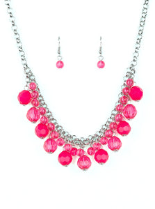 A collection of glassy and opaque pink crystal-like beads swing from the bottom of interlocking silver chains, creating a fabulous fringe below the collar. Features an adjustable clasp closure.  Sold as one individual necklace. Includes one pair of matching earrings.