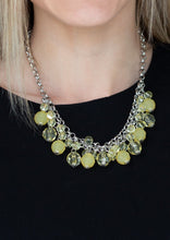Load image into Gallery viewer,   A collection of glassy and opaque yellow crystal-like beads swing from the bottom of interlocking silver chains, creating a fabulous fringe below the collar. Features an adjustable clasp closure.  Sold as one individual necklace. Includes one pair of matching earrings. 