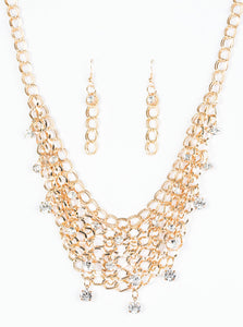 A collar of layered interlocking gold chain provides the canvas for gorgeous clear rhinestones to sway delicately. Features an adjustable clasp closure.  Sold as one individual necklace. includes one pair of marching earrings.