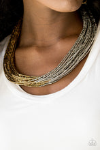 Load image into Gallery viewer, Brushed in a flashy metallic finish, countless strands of brass seed beads converge with strands of gunmetal seed beads, creating colorful layers below the collar. Features an adjustable clasp closure.  Sold as one individual necklace. Includes one pair of matching earrings.