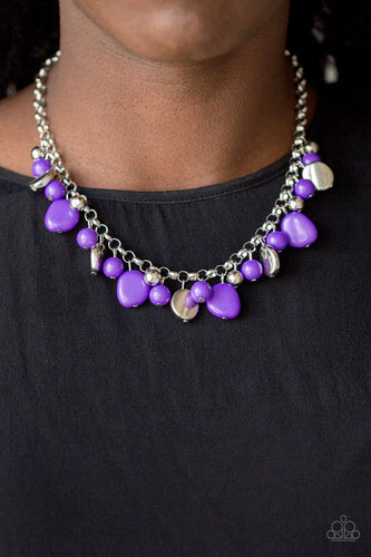 Featuring round and asymmetrical shapes, shiny silver and purple beads swing from the bottom of a bold silver chain, creating a flirtatious fringe below the collar. Features an adjustable clasp closure.  Sold as one individual necklace. Includes one pair of matching earrings.   Always nickel and lead free.