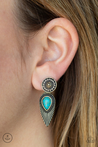 An ornate brass disc attaches to a double-sided post, designed to fasten behind the ear. Dotted with a turquoise stone center, the feathery double-sided post peeks out beneath the ear for a bold artisan look. Earring attaches to a standard post fitting.  Sold as one pair of double-sided post earrings.  Always nickel and lead free.