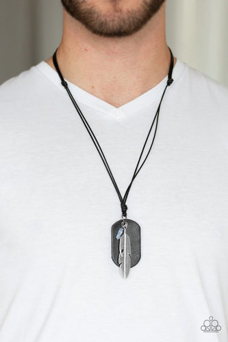 A black leather dog tag, lifelike silver feather, and refreshing blue stone are knotted in place at the bottom of a shiny black cord for an urban style. Features an adjustable sliding knot closure.  Sold as one individual necklace.  Always nickel and lead free.