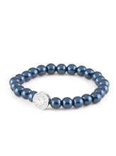 Load image into Gallery viewer, Blue pearls and a white rhinestone encrusted silver charm are threaded along a stretchy band, creating a glamorous centerpiece atop the wrist. Sold as one individual bracelet.