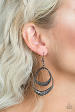 Load image into Gallery viewer, Scratched in shimmery textures, two asymmetrical gunmetal hoops swing from the bottom of a gunmetal link, creating a bold artisan inspired lure. Earring attaches to a standard fishhook fitting.  Sold as one pair of earrings.  Always nickel and lead free.