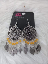 Load image into Gallery viewer, Dotted with a dainty iridescent rhinestone center, a mandala patterned silver frame gives way to a fringe of opaque orange beads and antiqued silver feathers, creating a whimsy centerpiece. Earring attaches to a standard fishhook fitting.  Sold as one pair of earrings.  Always nickel and lead free.  Fashion Fix Exclusive August 2021