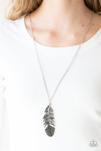 Featuring studded and antiqued textures, a dramatic silver feather pendant swings from the bottom of an elongated silver chain for a free-spirited fashion. Features an adjustable clasp closure.  Sold as one individual necklace. Includes one pair of matching earrings.  Always nickel and lead free.