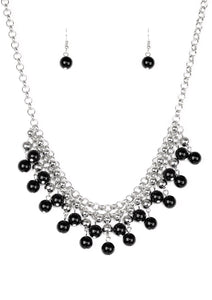 Rows of classic silver and shiny black beads trickle from two rows of interlocking silver chains, creating a bold colorful fringe below the collar. Features and adjustable clasp closure.  Sold as one individual necklace. Includes one pair of matching earrings.