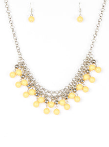 Rows of classic silver and sunny yellow beads trickle from two rows of interlocking silver chains, creating a bold colorful fringe below the collar. Features and adjustable clasp closure.  Sold as one individual necklace. Includes one pair of matching earrings.