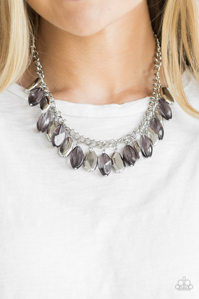 Cloudy faceted beads and imperfect silver teardrops drip from the bottom of a shimmery silver chain, creating a sassy fringe below the collar. Features an adjustable clasp closure.  Sold as one individual necklace. Includes one pair of matching earrings.   Always nickel and lead free.