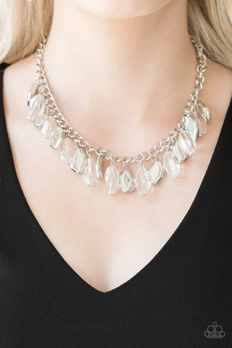 Faceted translucent beads and imperfect silver teardrops drip from the bottom of a shimmery silver chain, creating a sassy fringe below the collar. Features an adjustable clasp closure.  Sold as one individual necklace. Includes one pair of matching earrings.  Always nickel and lead free.