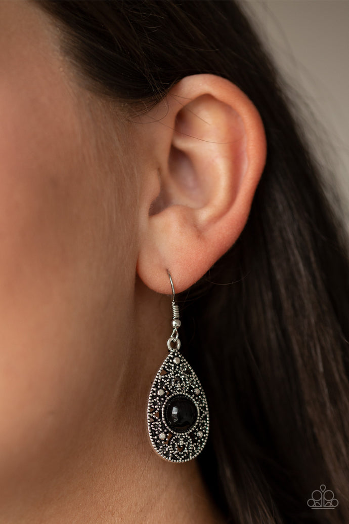 A shiny black bead is pressed into the center of a silver studded teardrop frame for a perfect pop of color. Earring attaches to a standard fishhook fitting.  Sold as one pair of earrings.  Always nickel and lead free. 