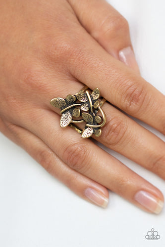 A trio of fluttering brass butterflies rest atop the finger, coalescing into a whimsical centerpiece. Features a stretchy band for a flexible fit.  Sold as one individual ring.  Always nickel and lead free.