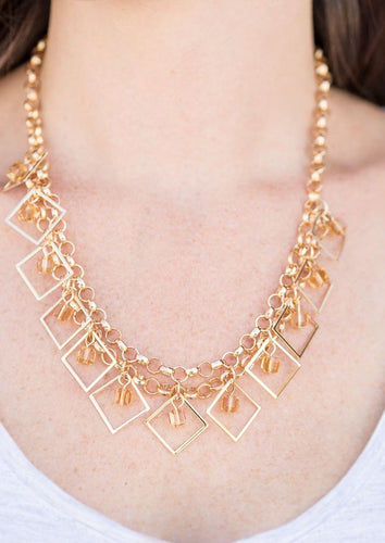 Featuring a glassy shimmer, golden cube beads swing from the tops of tilted square frames, creating a fierce geometric fringe below the collar. Features an adjustable clasp closure.  Sold as one individual necklace. Includes one pair of matching earrings.