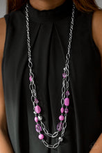 Load image into Gallery viewer, Featuring smooth and faceted surfaces, purple and shiny silver beads trickle along bold silver chains for a seasonal look. Features an adjustable clasp closure.  Sold as one individual necklace. Includes one pair of matching earrings.