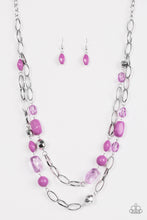 Load image into Gallery viewer, Featuring smooth and faceted surfaces, purple and shiny silver beads trickle along bold silver chains for a seasonal look. Features an adjustable clasp closure.  Sold as one individual necklace. Includes one pair of matching earrings.