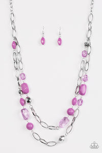 Featuring smooth and faceted surfaces, purple and shiny silver beads trickle along bold silver chains for a seasonal look. Features an adjustable clasp closure.  Sold as one individual necklace. Includes one pair of matching earrings.
