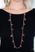 Load image into Gallery viewer, Varying in size, a collection of glassy red crystal-like beads trickle down a shimmery silver chain across the chest for a whimsical look. Features an adjustable clasp closure.  Sold as one individual necklace. Includes one pair of matching earrings.  Always nickel and lead free!