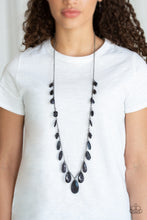 Load image into Gallery viewer, A gorgeous collection of glassy and cloudy black crystal-like beads trickle along a shimmery silver chain down the chest in a whimsical fashion. Features an adjustable clasp closure.  Sold as one individual necklace. Includes one pair of matching earrings.  Always nickel and lead free.