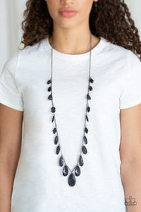 A gorgeous collection of glassy and cloudy black crystal-like beads trickle along a shimmery silver chain down the chest in a whimsical fashion. Features an adjustable clasp closure.  Sold as one individual necklace. Includes one pair of matching earrings.  Always nickel and lead free.