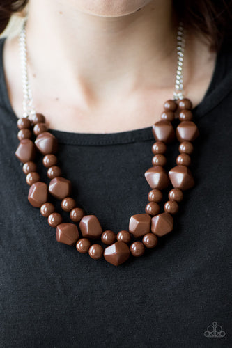 Tiers of round and abstract brown beading layer below the collar in a colorful tribal fashion. Features an adjustable clasp closure.  Sold as one individual necklace. Includes one pair of matching earrings.  Always nickel and lead free.