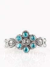 Load image into Gallery viewer, Glittery blue rhinestones bloom from a white rhinestone center, creating a glamorous floral band. Features a dainty stretchy band for a flexible fit.  Sold as one individual ring.