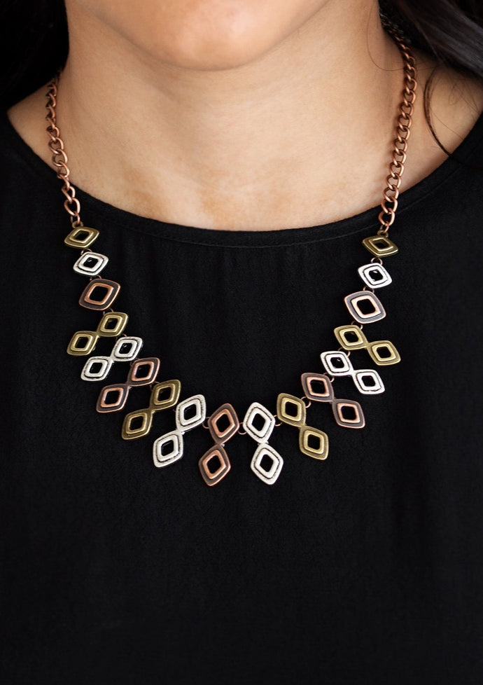 Brushed in an antiqued shimmer, glistening diamond-shaped copper, brass, and silver frames link below the collar, coalescing into an edgy geometric fringe. Features an adjustable clasp closure.  Sold as one individual necklace. Includes one pair of matching earrings.  Always nickel and lead free.