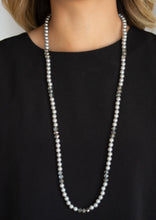 Load image into Gallery viewer, Infused with sections of smoky crystal-like beads, a timeless collection of silver pearls are threaded along an invisible wire across the chest for a refined flair. Features an adjustable clasp closure.  Sold as one individual necklace. Includes one pair of matching earrings.