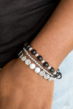 Load image into Gallery viewer, Mismatched silver and shiny black beads are threaded along stretchy elastic bands, creating colorful layers across the wrist.  Sold as one set of three bracelets. Always nickel and lead free.
